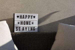 At home on the balcony, sign 'happy home staying' At home on the balcony, sign 'happy home staying'